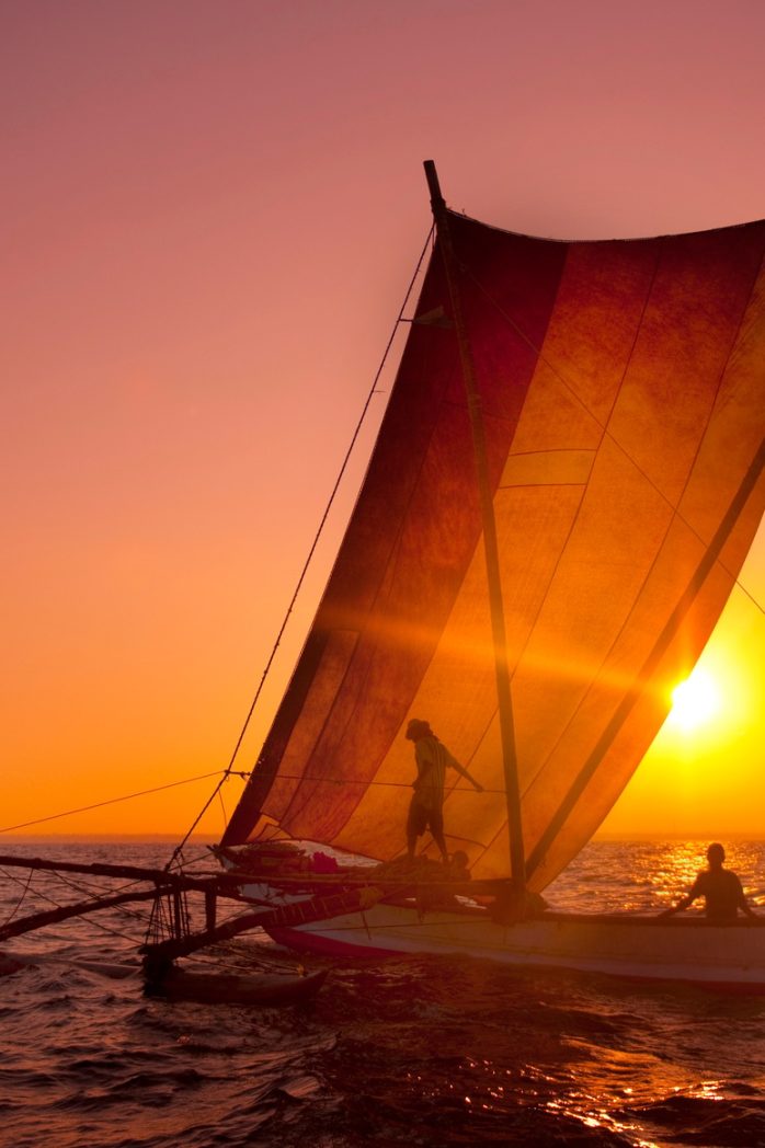 Fishermen on a catamaran at Sunset. Sri Lanka